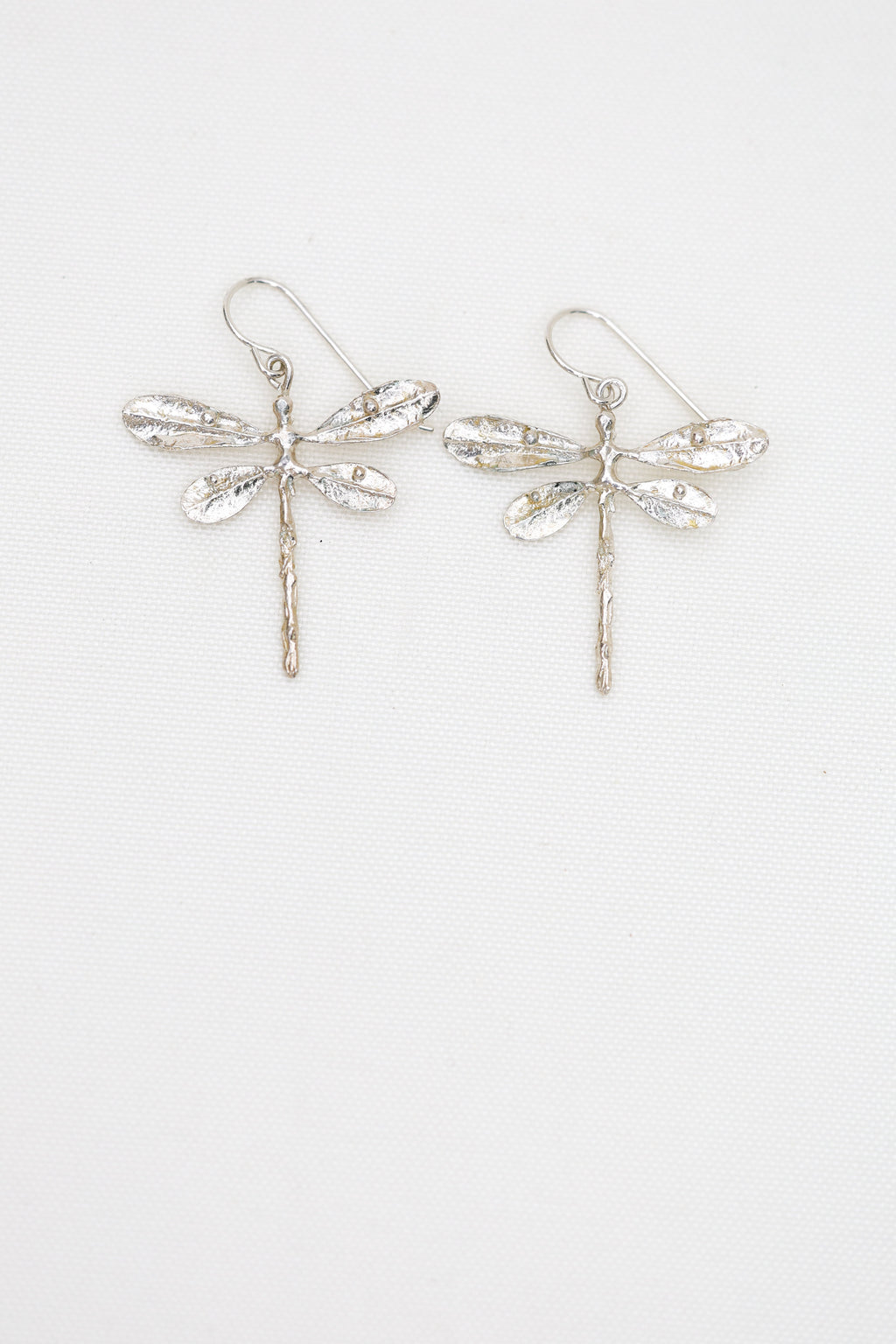 Dragonfly dangles lightweight and made in sterling silver or brass, lost wax cast