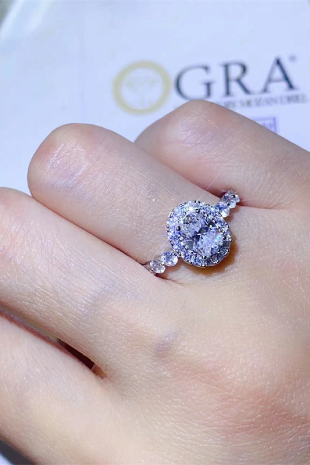 Adored 1 Carat Oval-Cut Sparkala™ Platinum Over Pure Sterling Silver Halo Ring