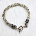 Handmade 10mm silver Viking knit bracelet with Ruby charm
