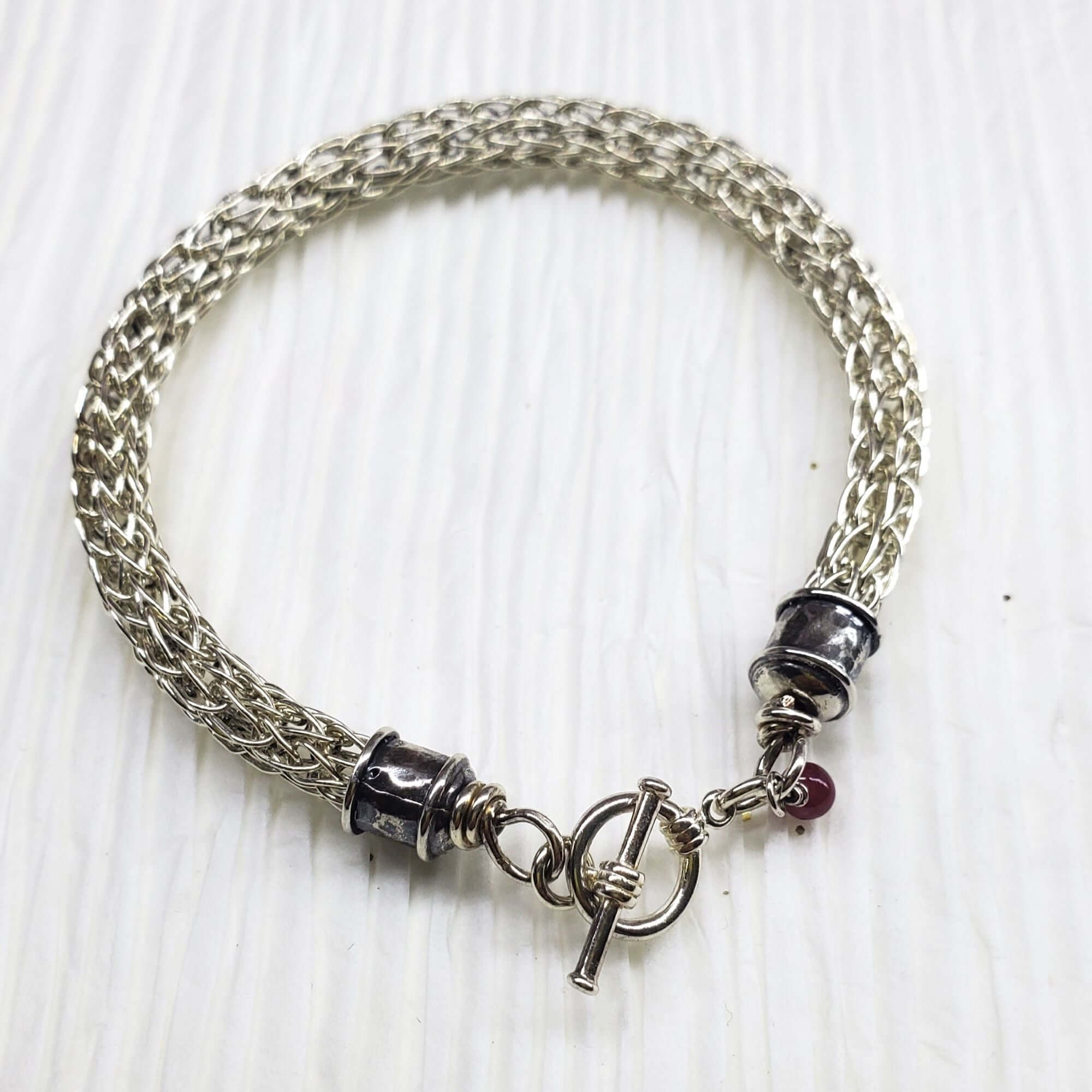 Handmade 10mm silver Viking knit bracelet with Ruby charm