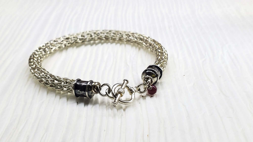 Handmade 10mm silver Viking knit bracelet with Ruby charm