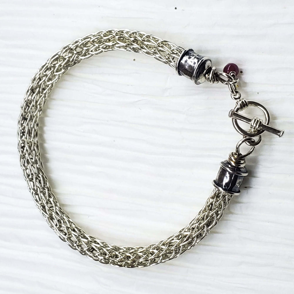Handmade 10mm silver Viking knit bracelet with Ruby charm