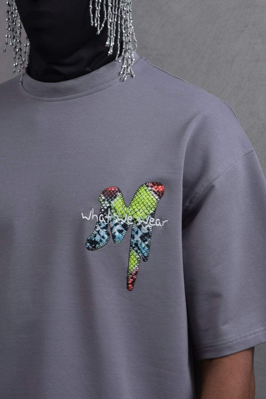 Oversize Graphic Cotton Tee – "What We Wear" Abstract Print