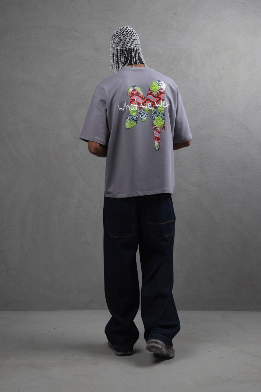 Oversize Graphic Cotton Tee – "What We Wear" Abstract Print