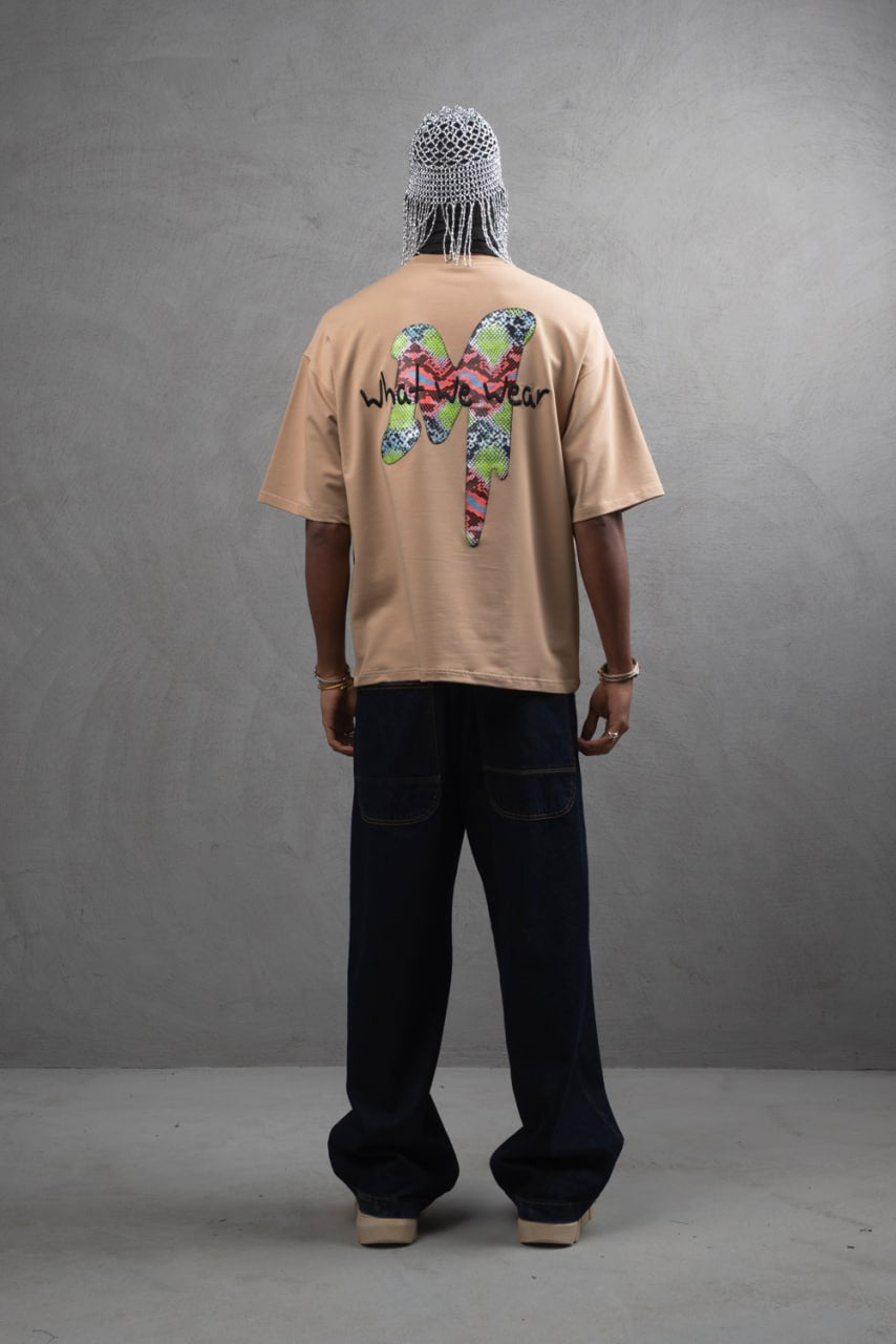 Oversize Graphic Cotton Tee – "What We Wear" Abstract Print