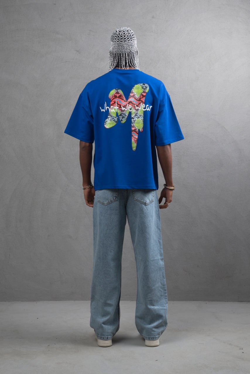 Oversize Graphic Cotton Tee – "What We Wear" Abstract Print