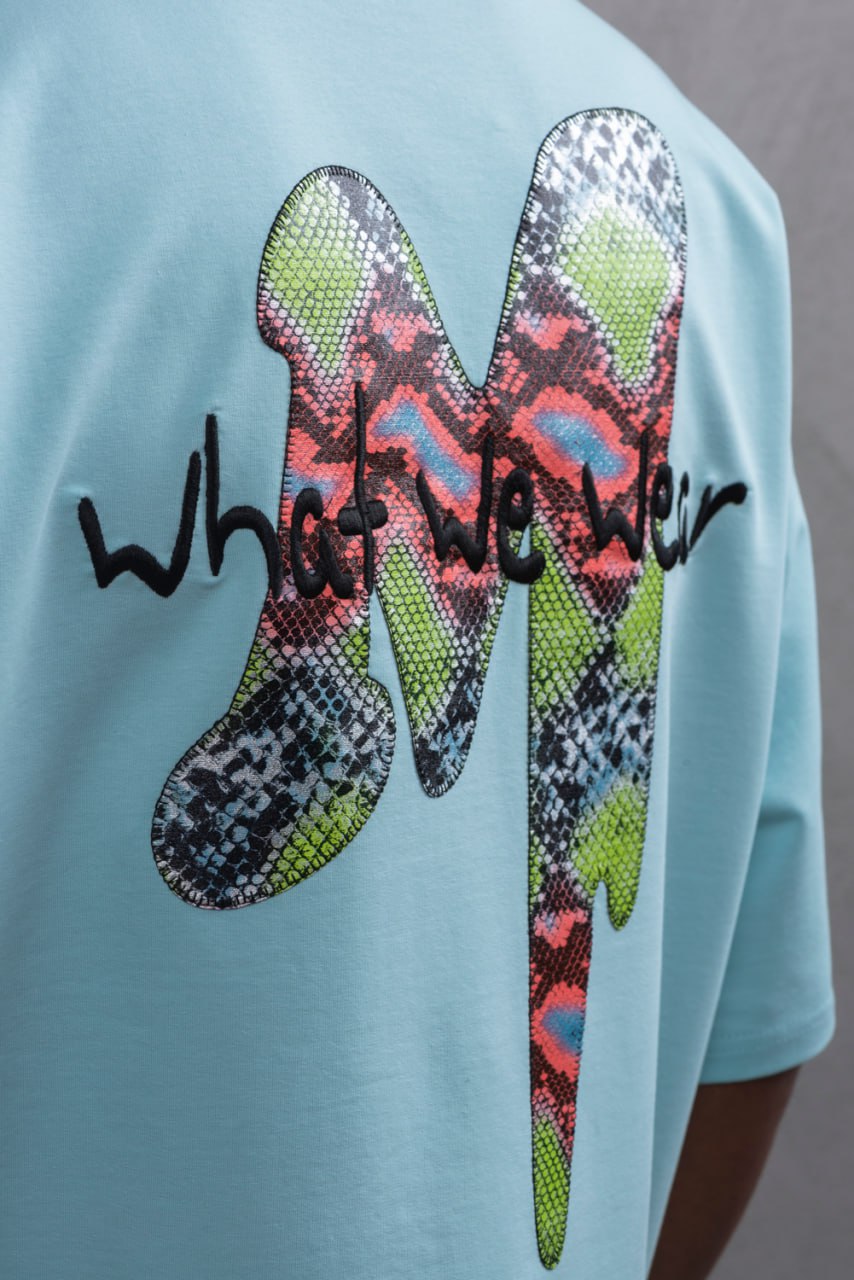 Oversize Graphic Cotton Tee – "What We Wear" Abstract Print
