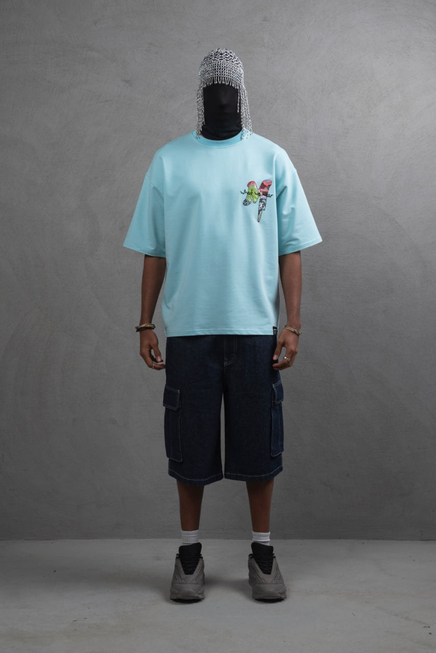 Oversize Graphic Cotton Tee – "What We Wear" Abstract Print