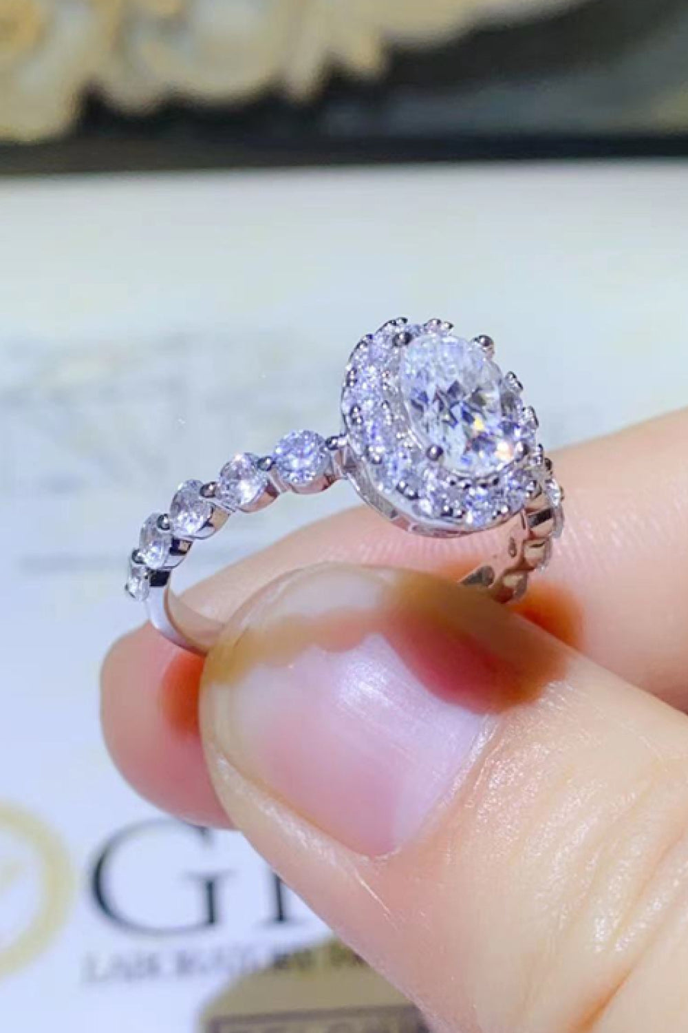 Adored 1 Carat Oval-Cut Sparkala™ Platinum Over Pure Sterling Silver Halo Ring